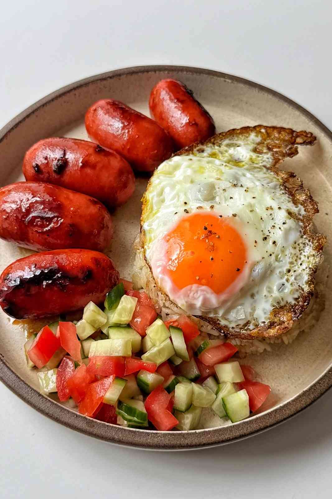 BBQOMBOY silog combo meal with rice, egg and sausage